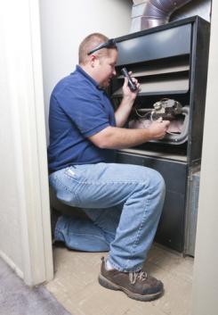 Sam, one of our Fairfax furnace repair experts, is doing a routine maintenance check